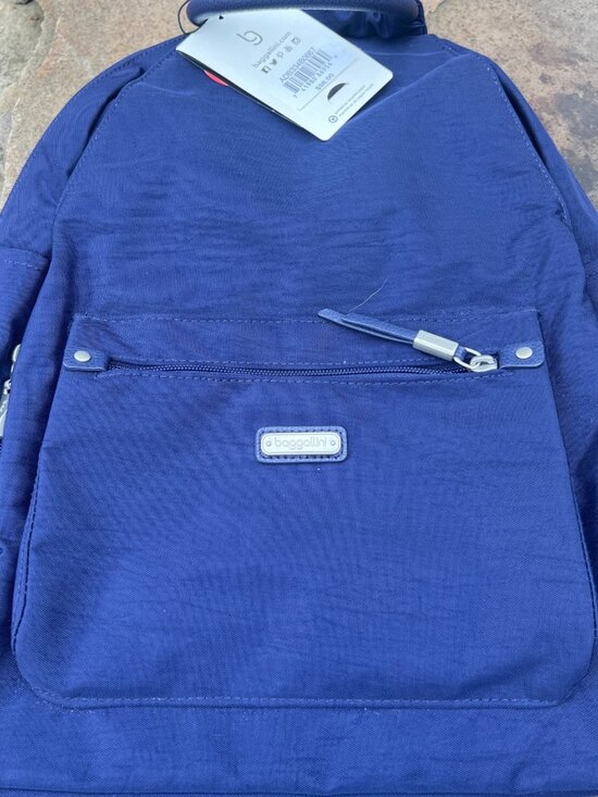 Baggallini Handbags - Baggaliini everyday backpack navy blue includes RIFD wallet NWT